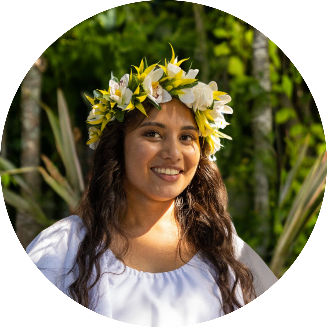 Website headshots Tevan Brandt. A Māori woman with dark wavy hair turquoise top.